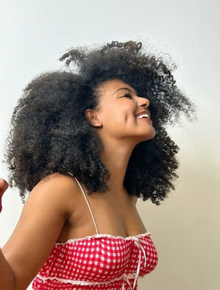 10 Curly Hair Travel Tips For The Perfect Holiday Hair